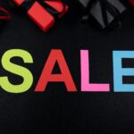 Vibrant SALE text surrounded by gift boxes offers perfect promotional imagery.
